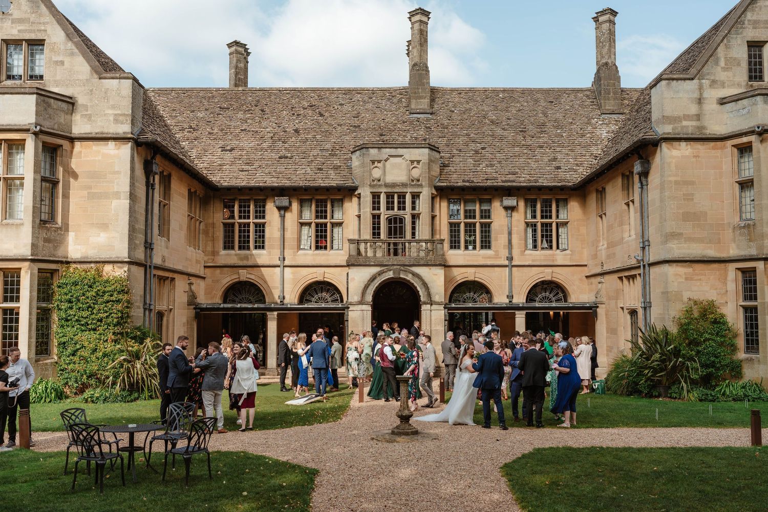 Coombe Lodge Wedding Photographer Zara Davis Photography back of venue during drinks reception September