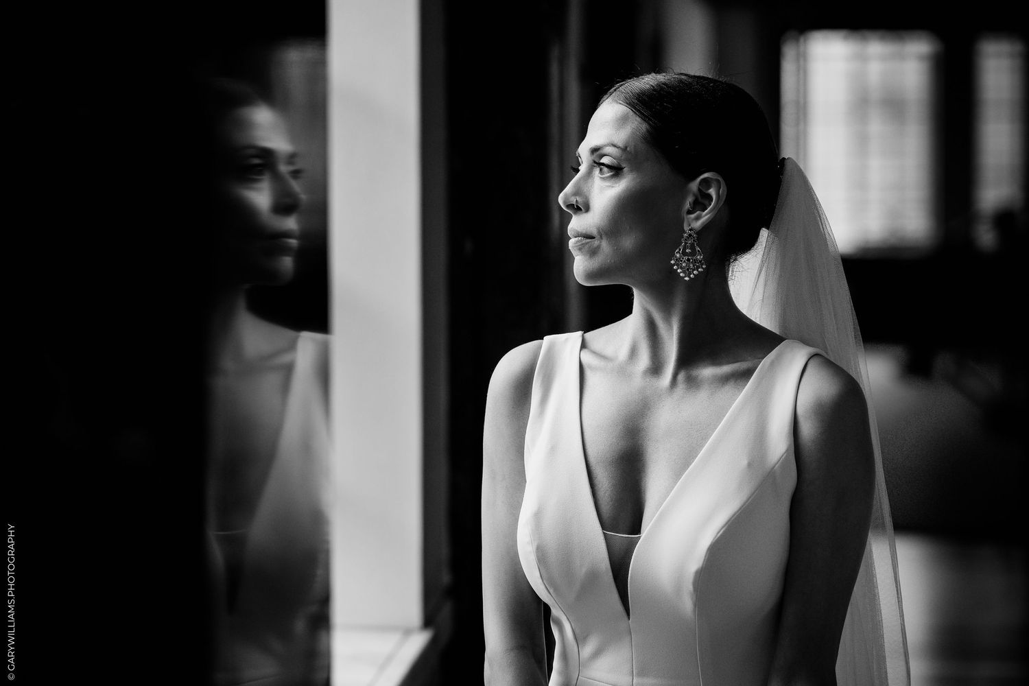 Black and white fashion portrait series showing same woman looking thoughtful and elegant in six different poses.