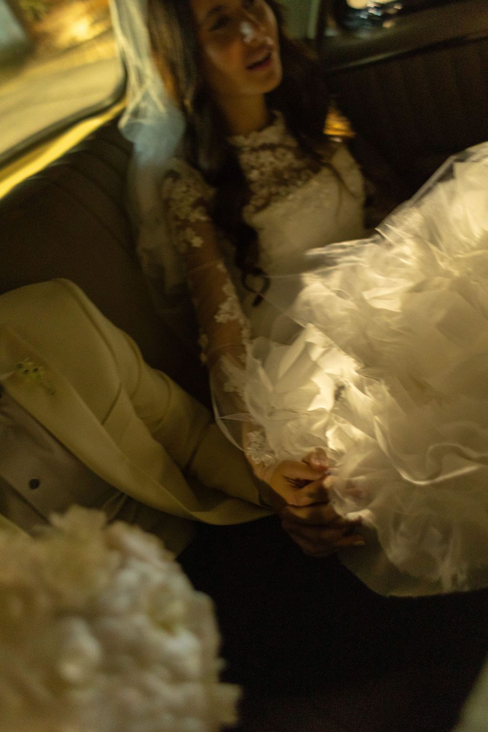 A fluffy white tulle wedding dress displayed in various angles showing its voluminous skirt and elegant details.