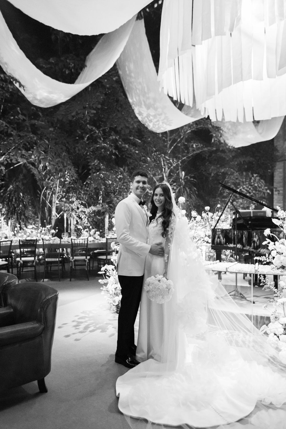 Wedding venue decorated with white streamers and elegant decor creating a romantic atmosphere for the celebration.