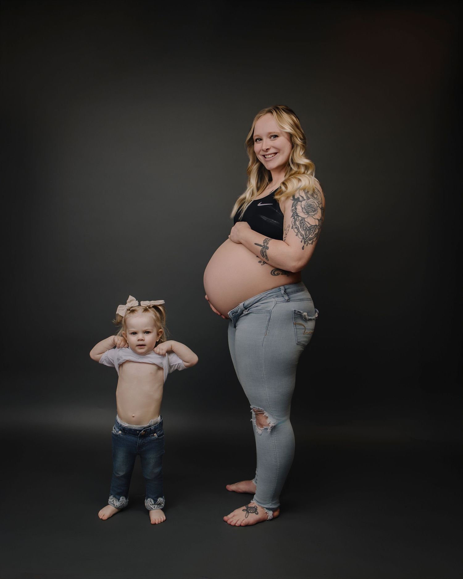 A creative maternity photo shoot progression showing mother and child interacting in silhouette against a dark background.