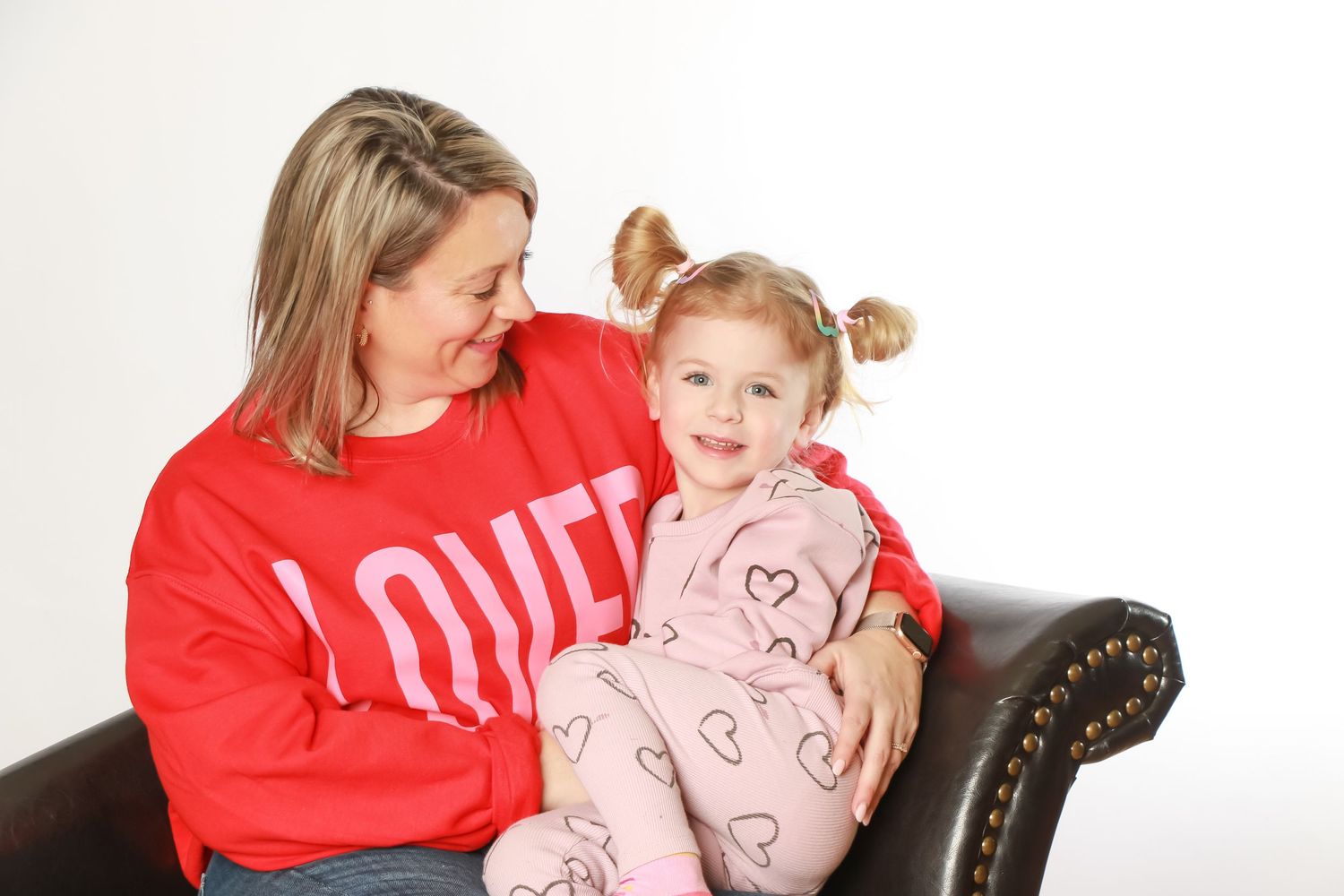 Parents and kids smiling during a relaxed in-studio photo session