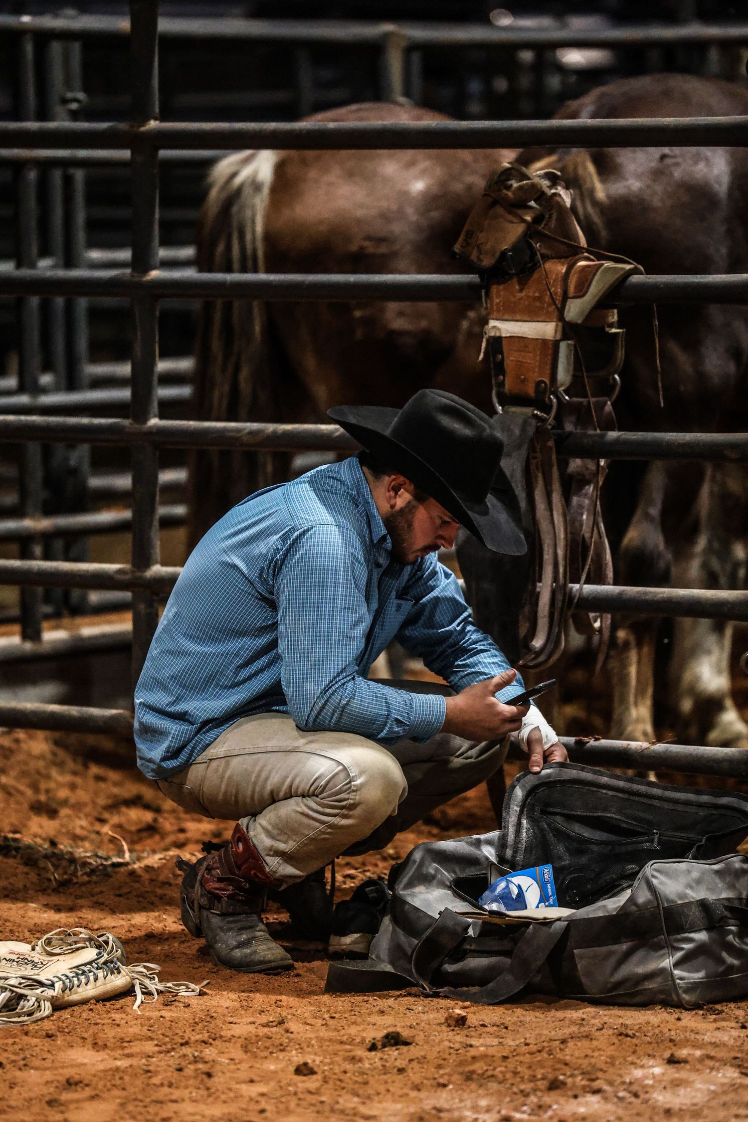 Behind the chutes getting ready for his retirement ride. Bronc Rider