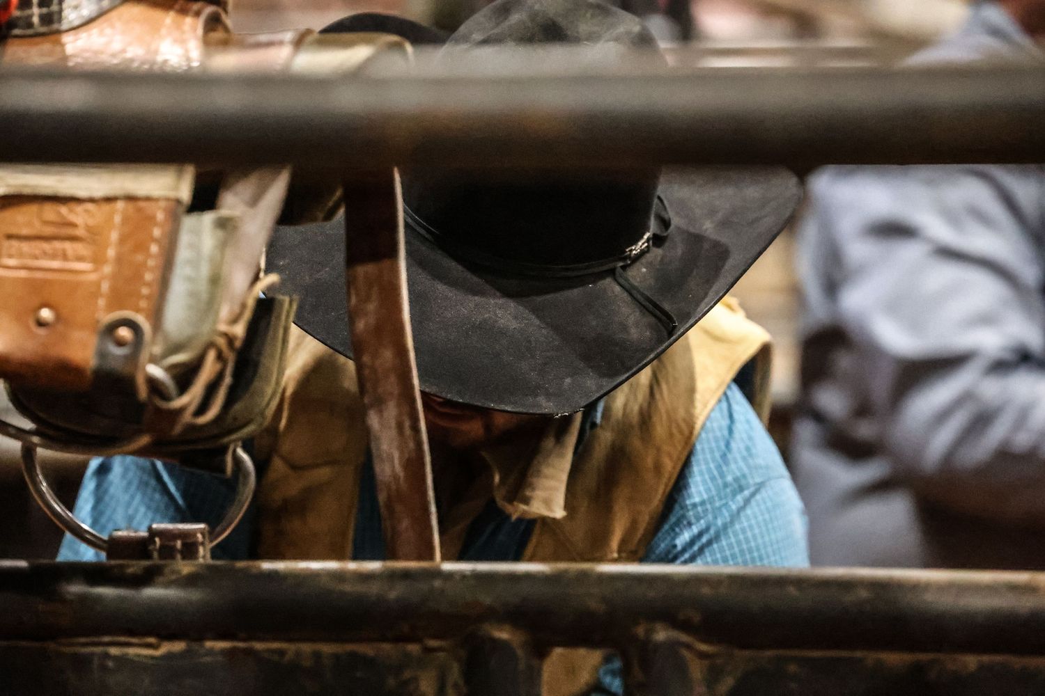 Behind the chutes getting ready for his retirement ride. Bronc Rider
