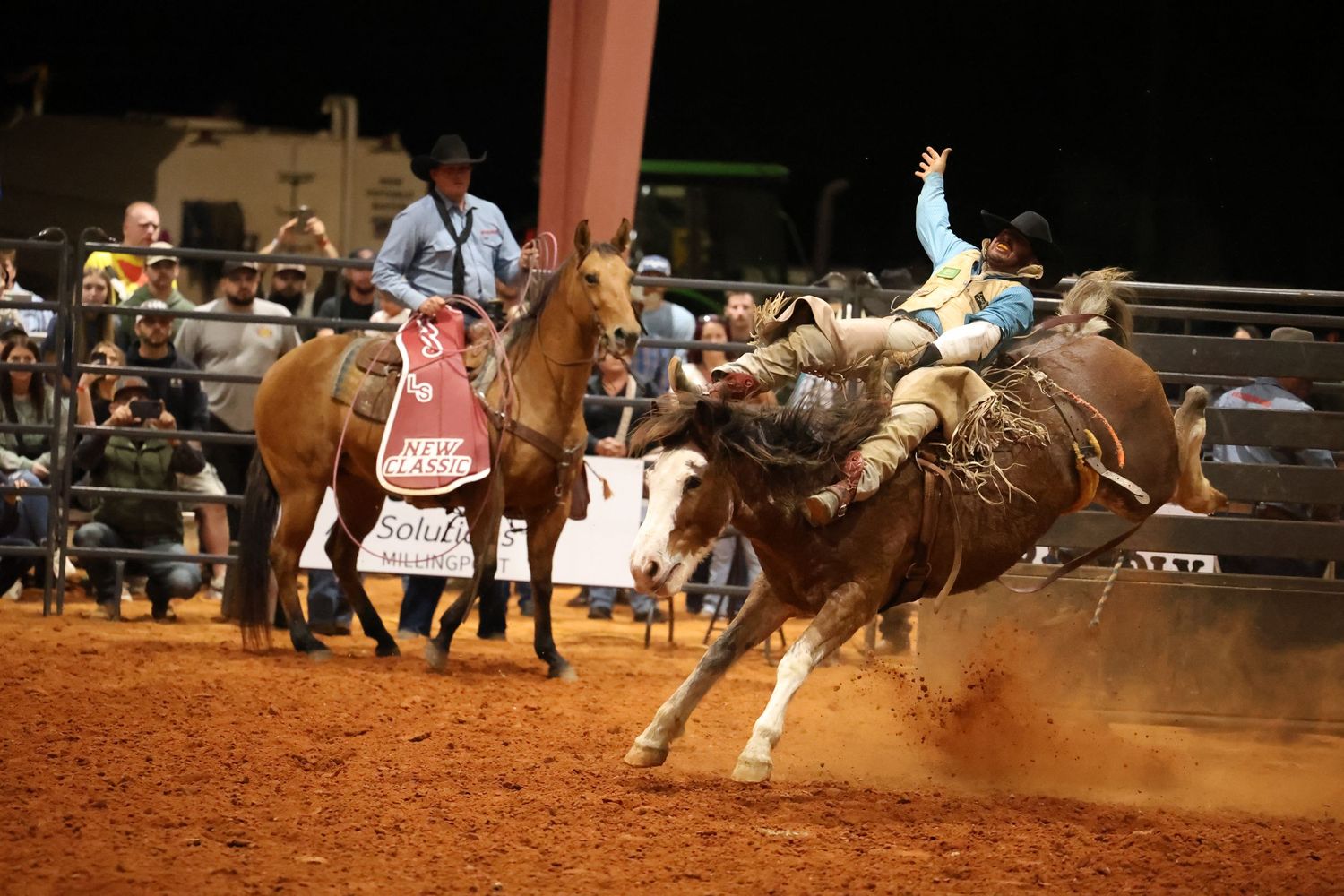 Behind the chutes getting ready for his retirement ride. Bronc Rider