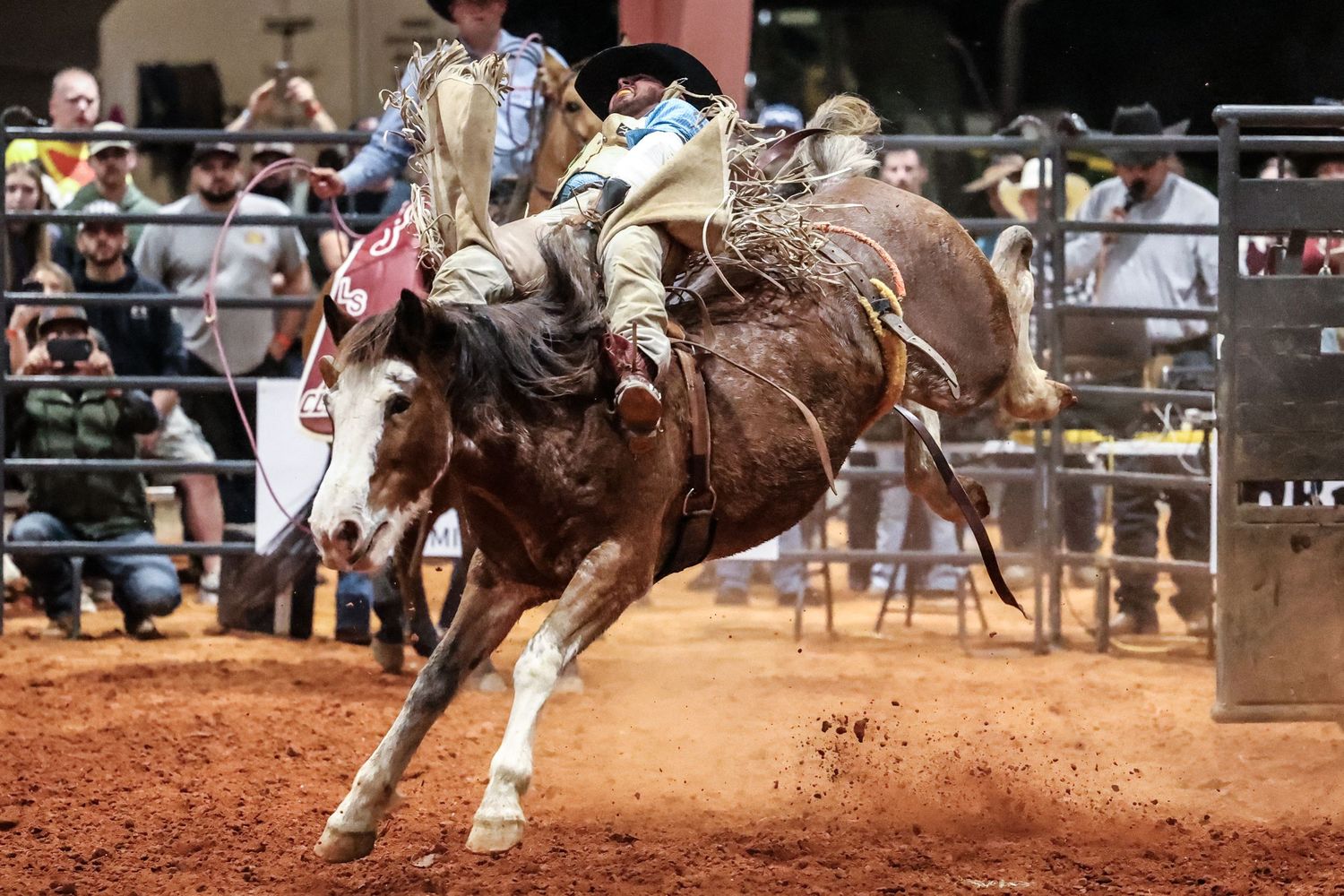 Behind the chutes getting ready for his retirement ride. Bronc Rider