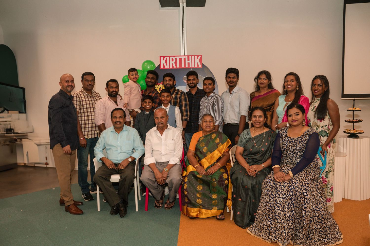 A group photo of party guests gathered together at a celebration event.
