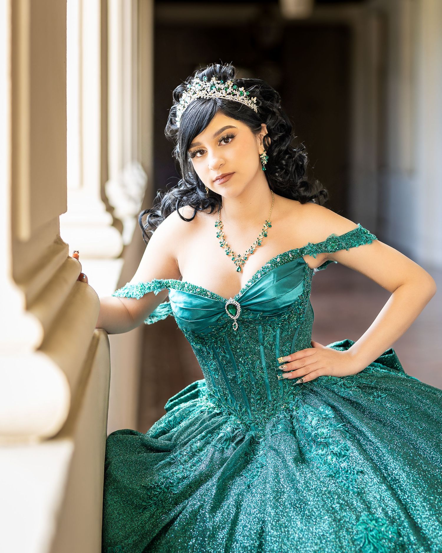 Model poses in a Quinceañera dress using natural light. A professional photographer is able to take a high-quality photo of a Quinceañera.