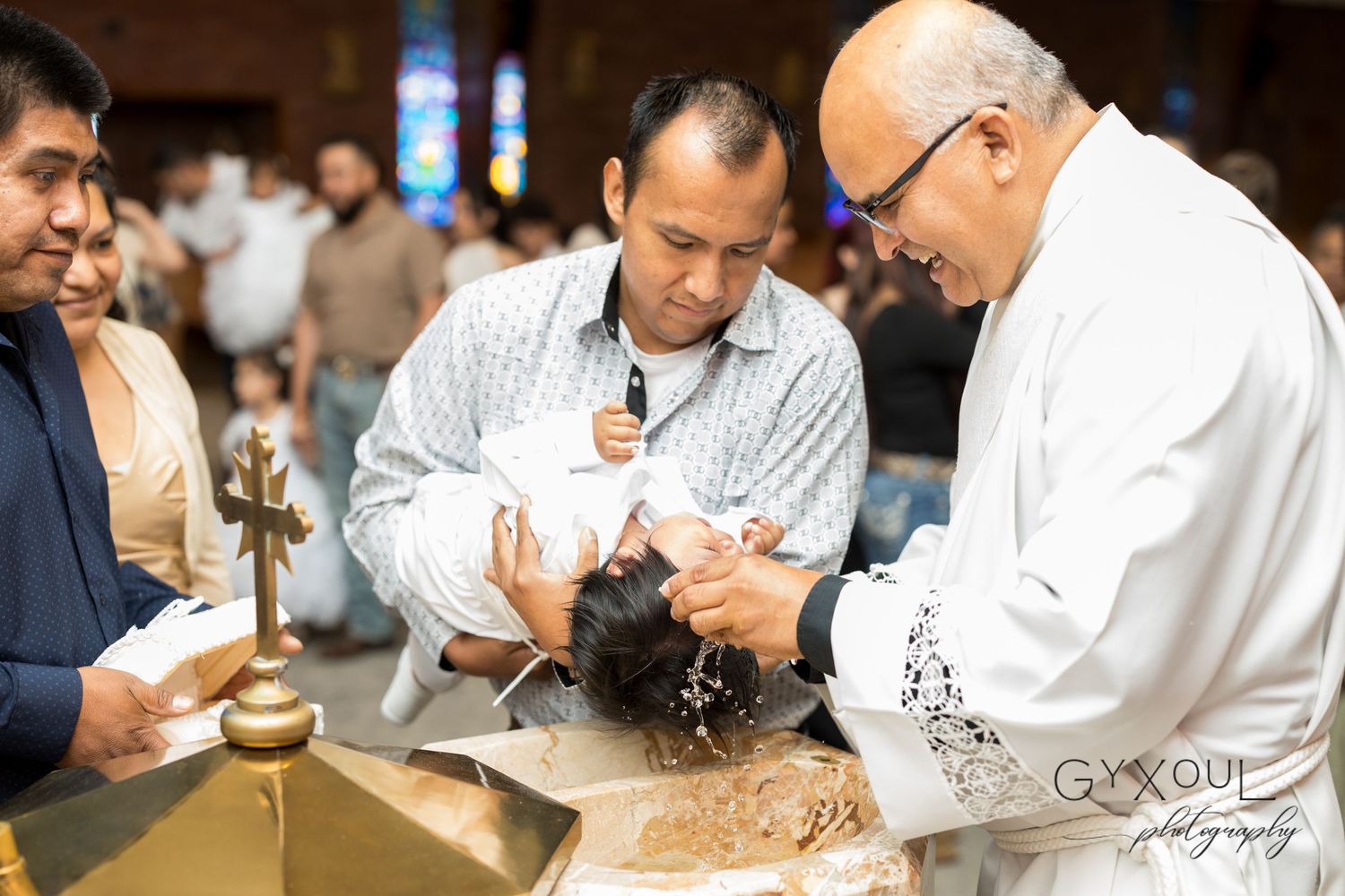 Religious ceremony showing clergy members performing a traditional ritual with sacred objects.