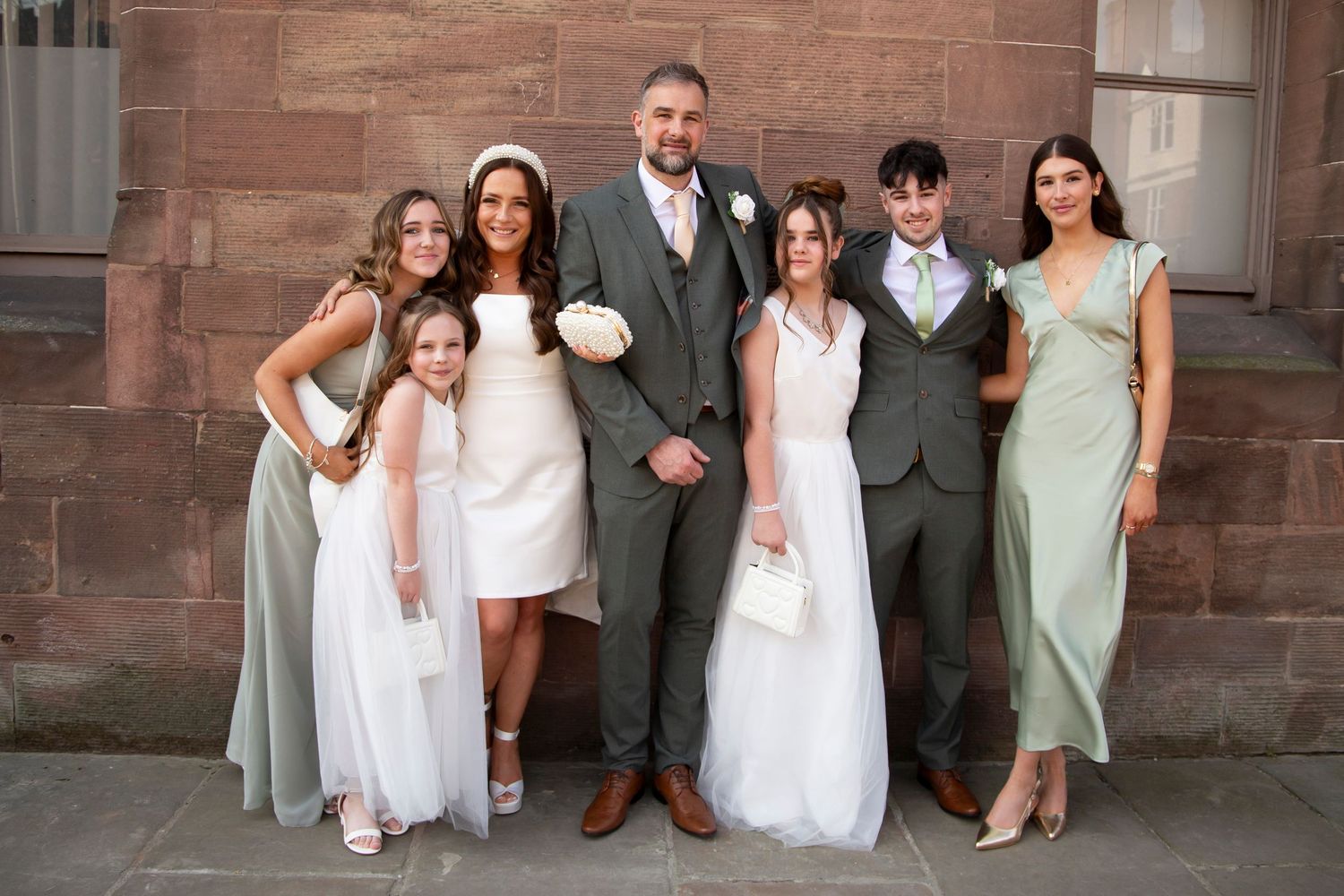 Bride and Groom with their children bridesmaids groomsmen at Chester Town Hall wedding registry office