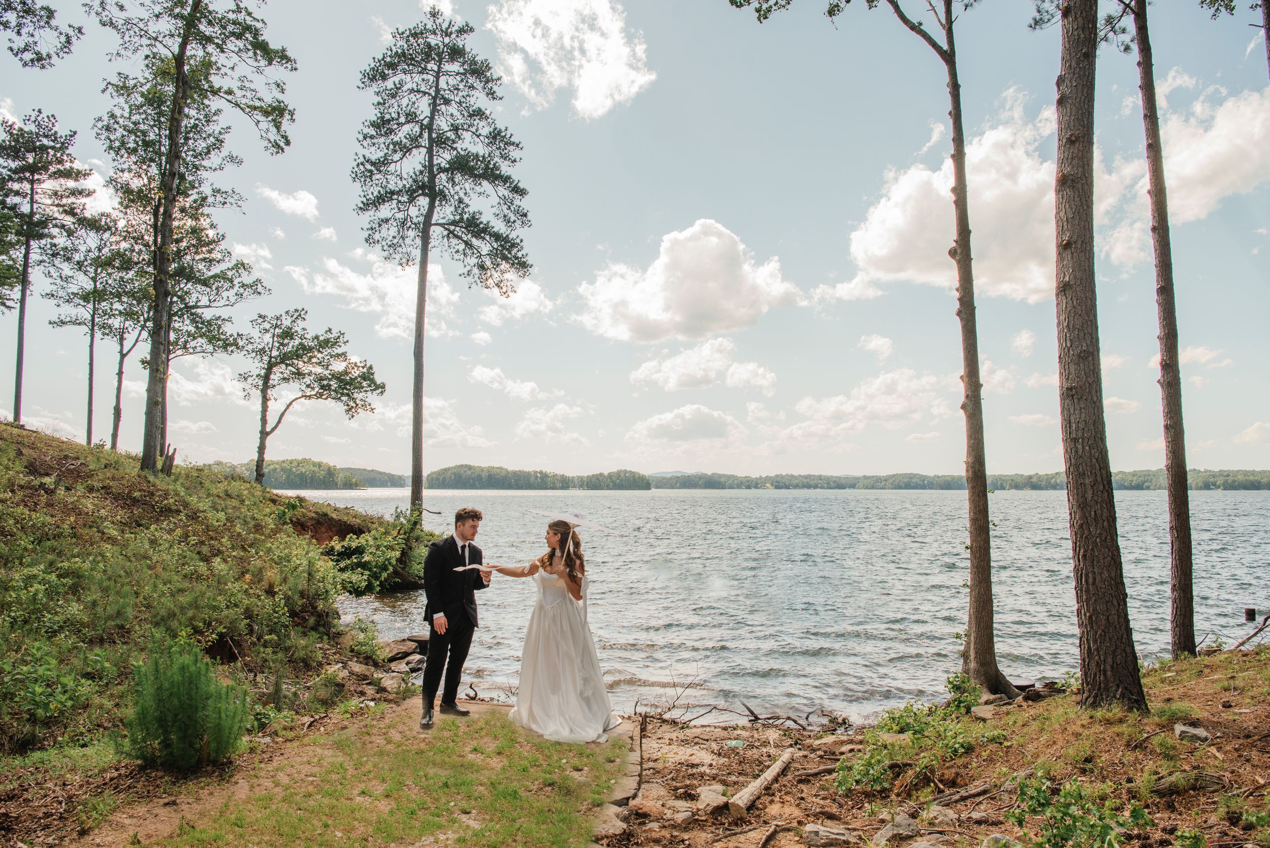 Scenic lakeside wedding photography with pine trees and natural shoreline.