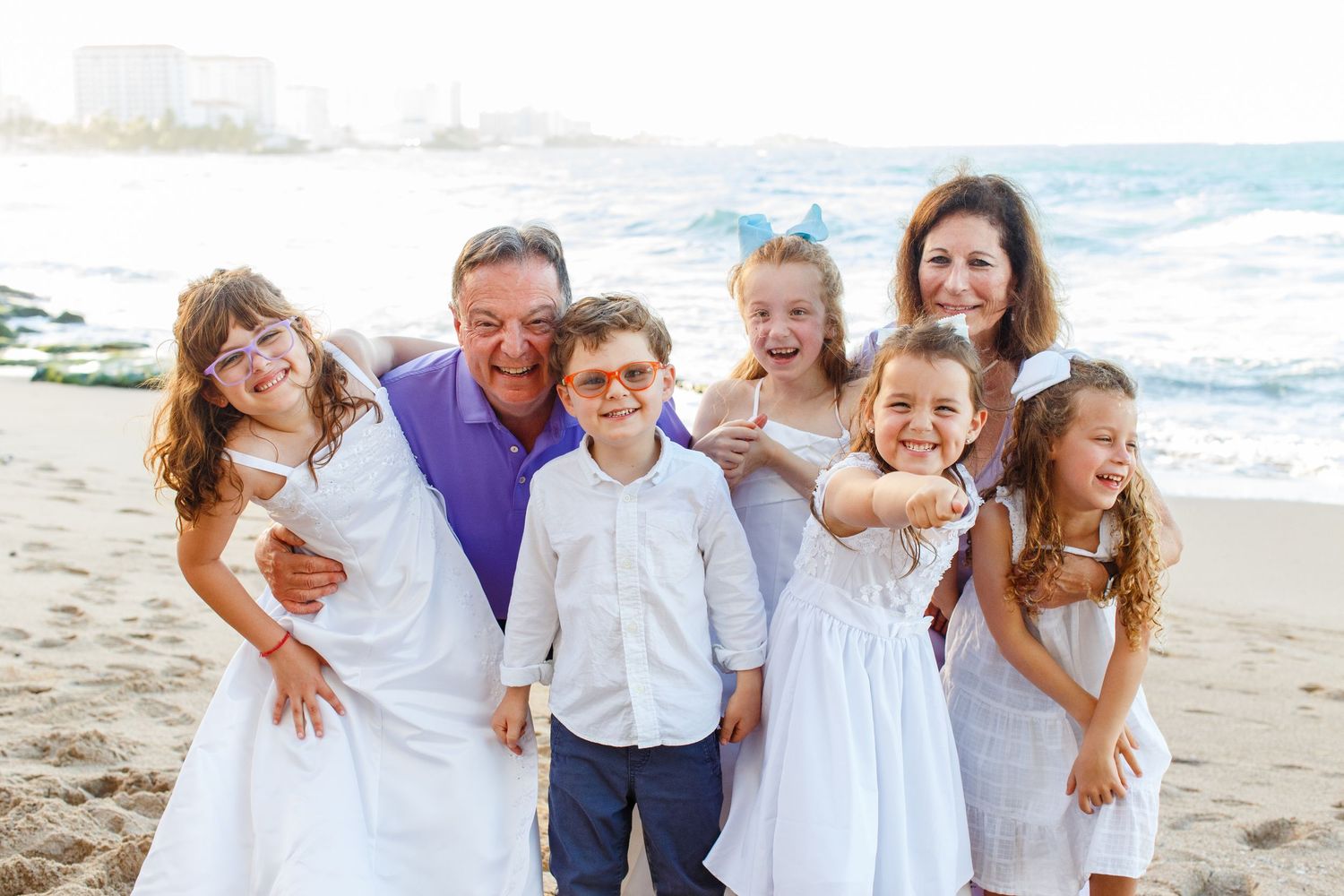 Family portrait on the beach. Grandparents and grandchildren. San Juan, Puerto Rico.