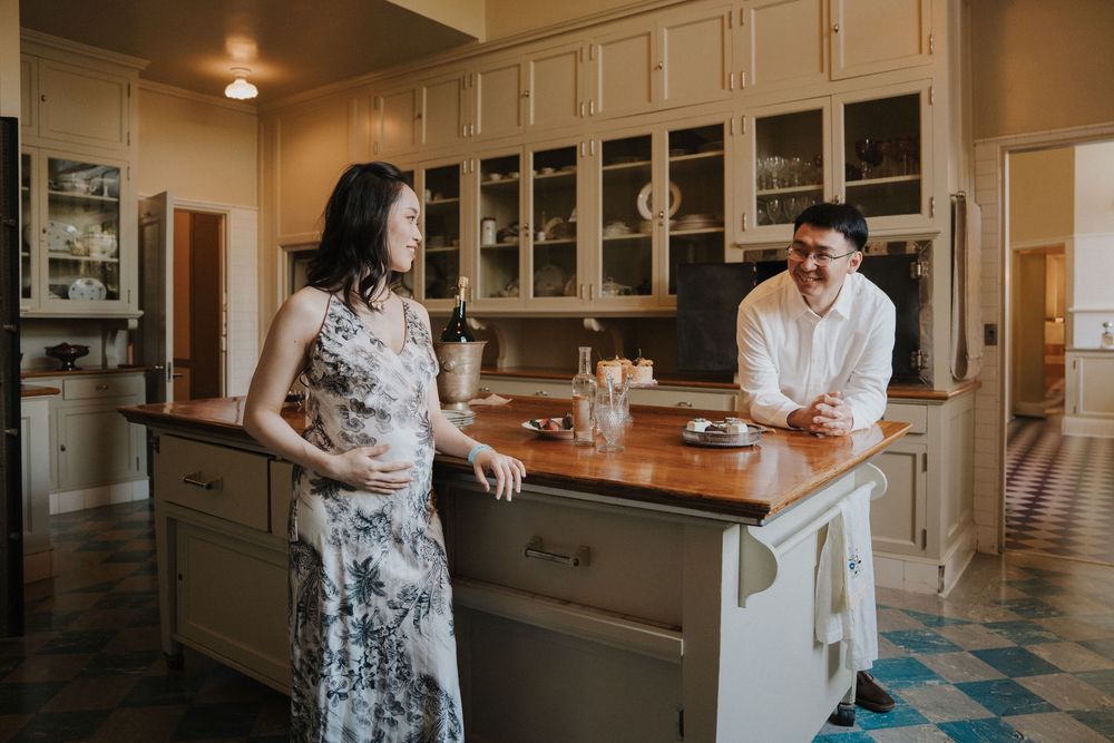 Couple cooking together in a cozy kitchen, preparing ingredients and sharing intimate moments.