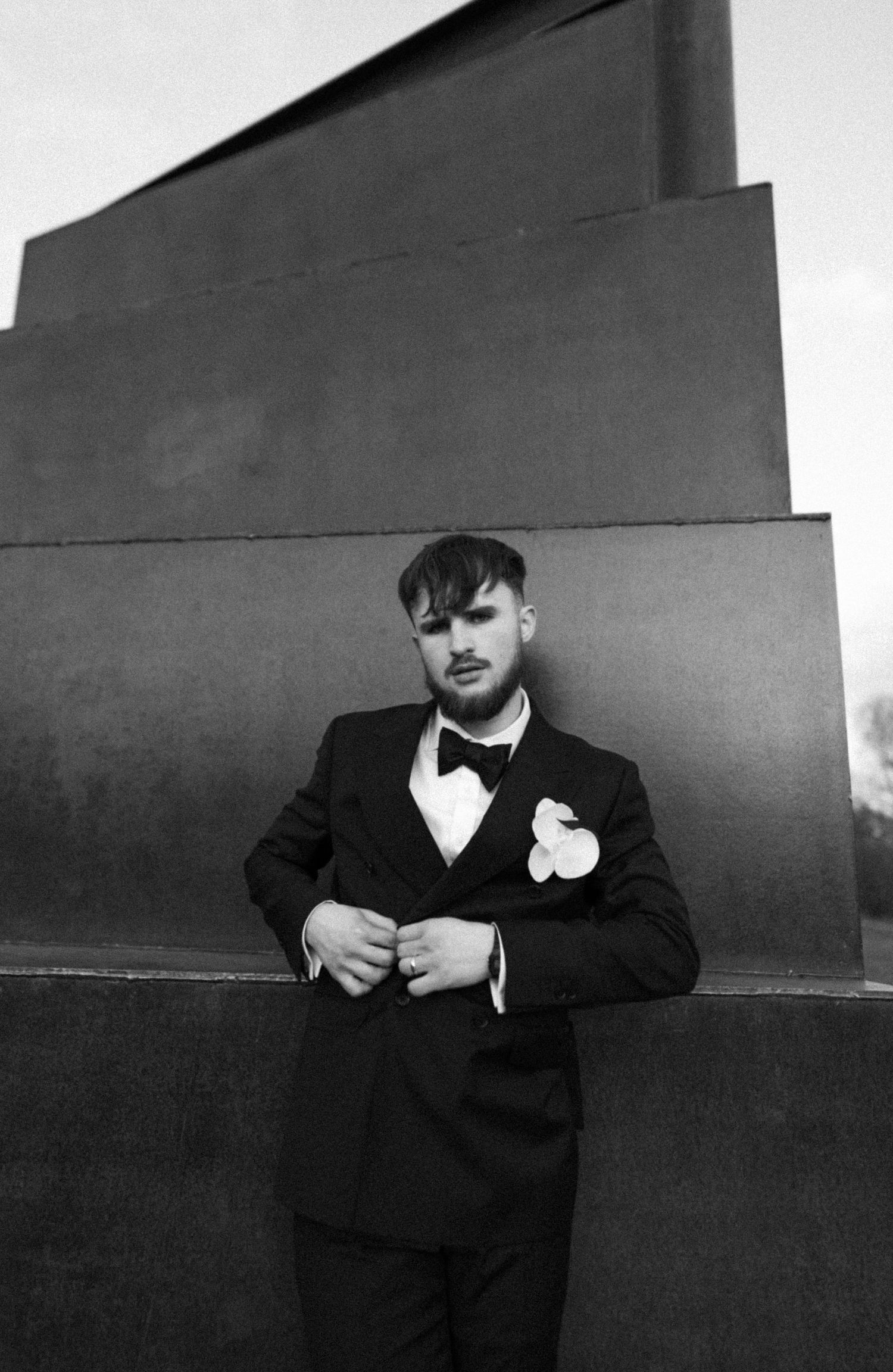 B&W Editorial portrait of groom.