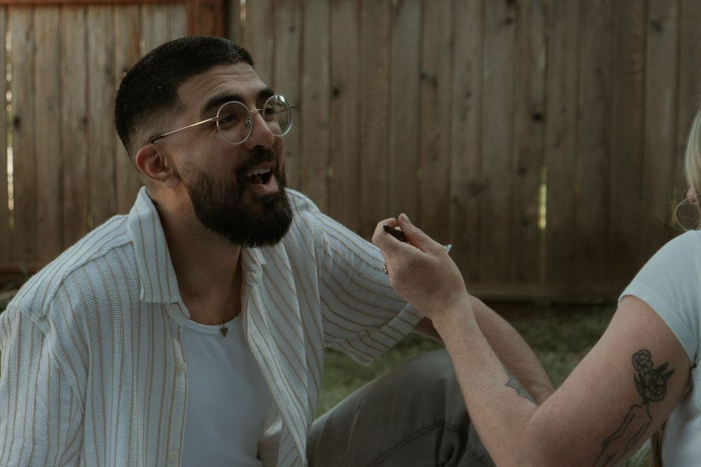 A playful interaction during an informal outdoor photo session.