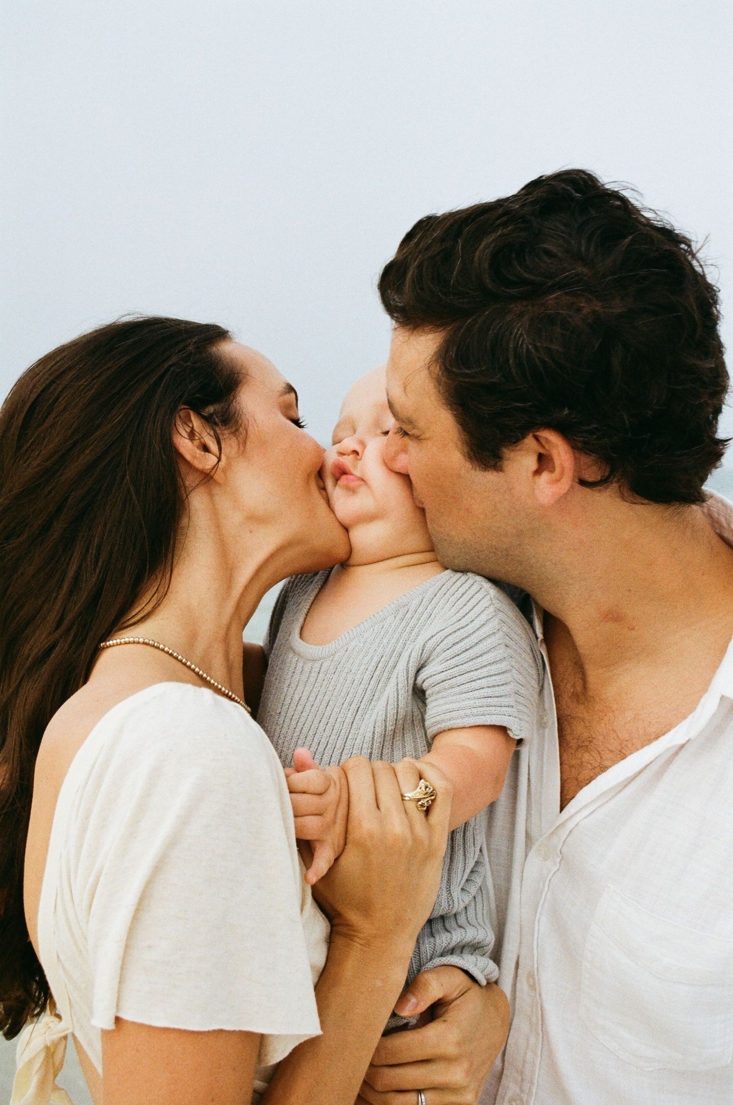 Intimate family moment captured in warm natural light.