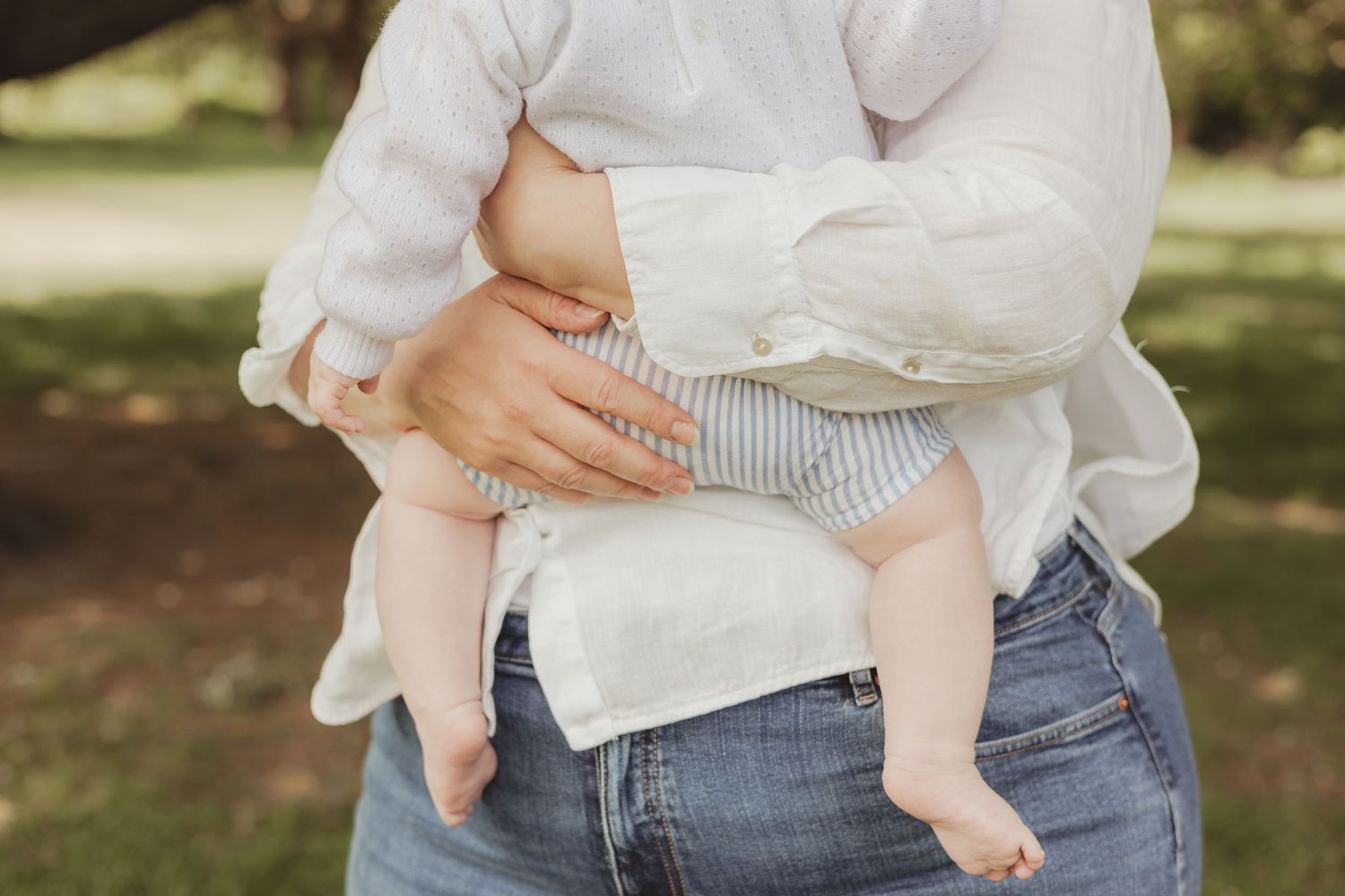 mum holding baby boy - outdoor on Wandsworth common