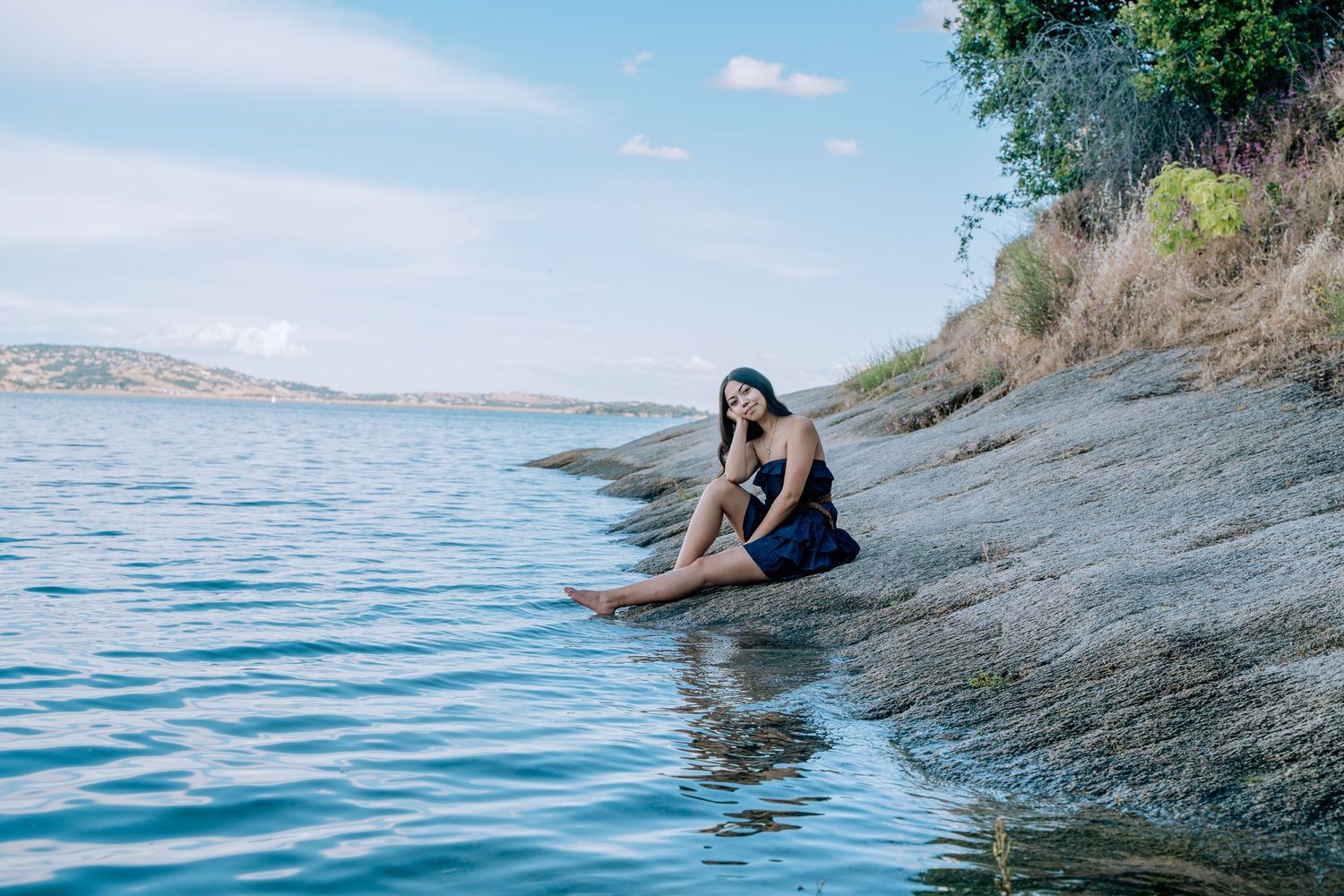 Series of scenic shots by blue water with rocks and natural coastline.