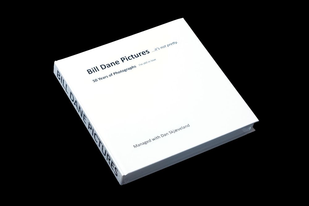 White book covers shown in progressive perspective views against black background.