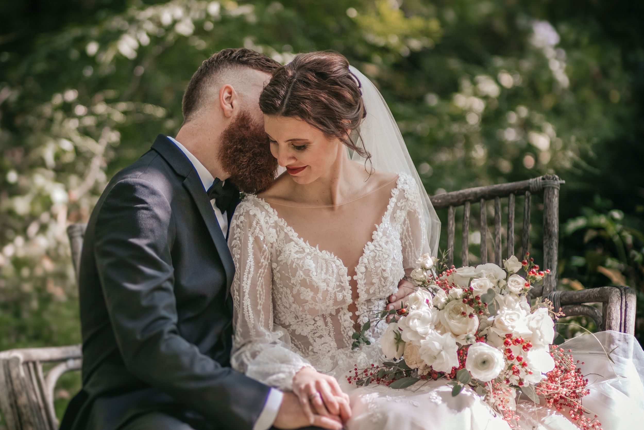 Romantic wedding portraits with lush greenery and elegant floral arrangements.