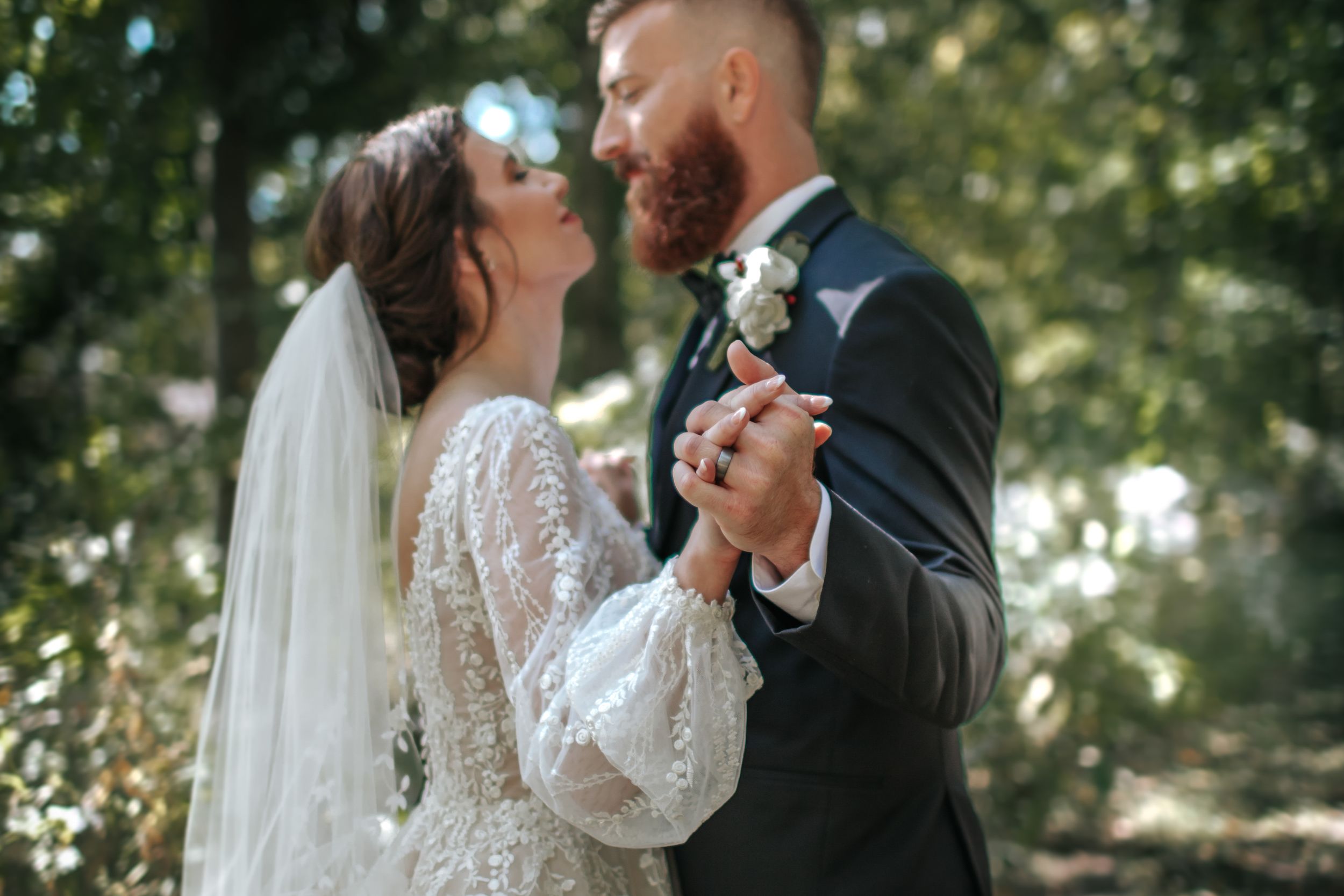 Natural light wedding photography captures romantic moments between bride and groom.