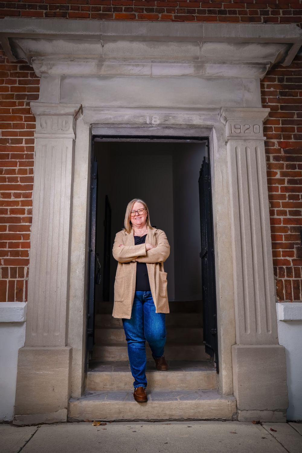 A series of architectural photos showing a person posing in different positions against a brick building entrance with columns.