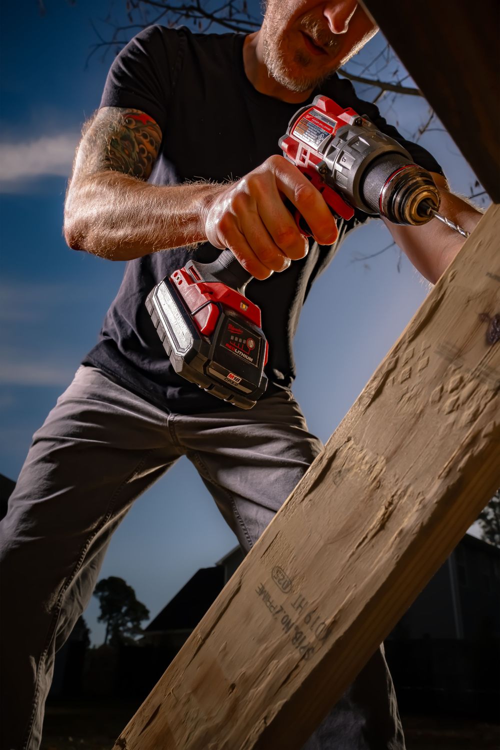 Close-up sequence showing hands using power tools to drill into wooden boards against a dark background.