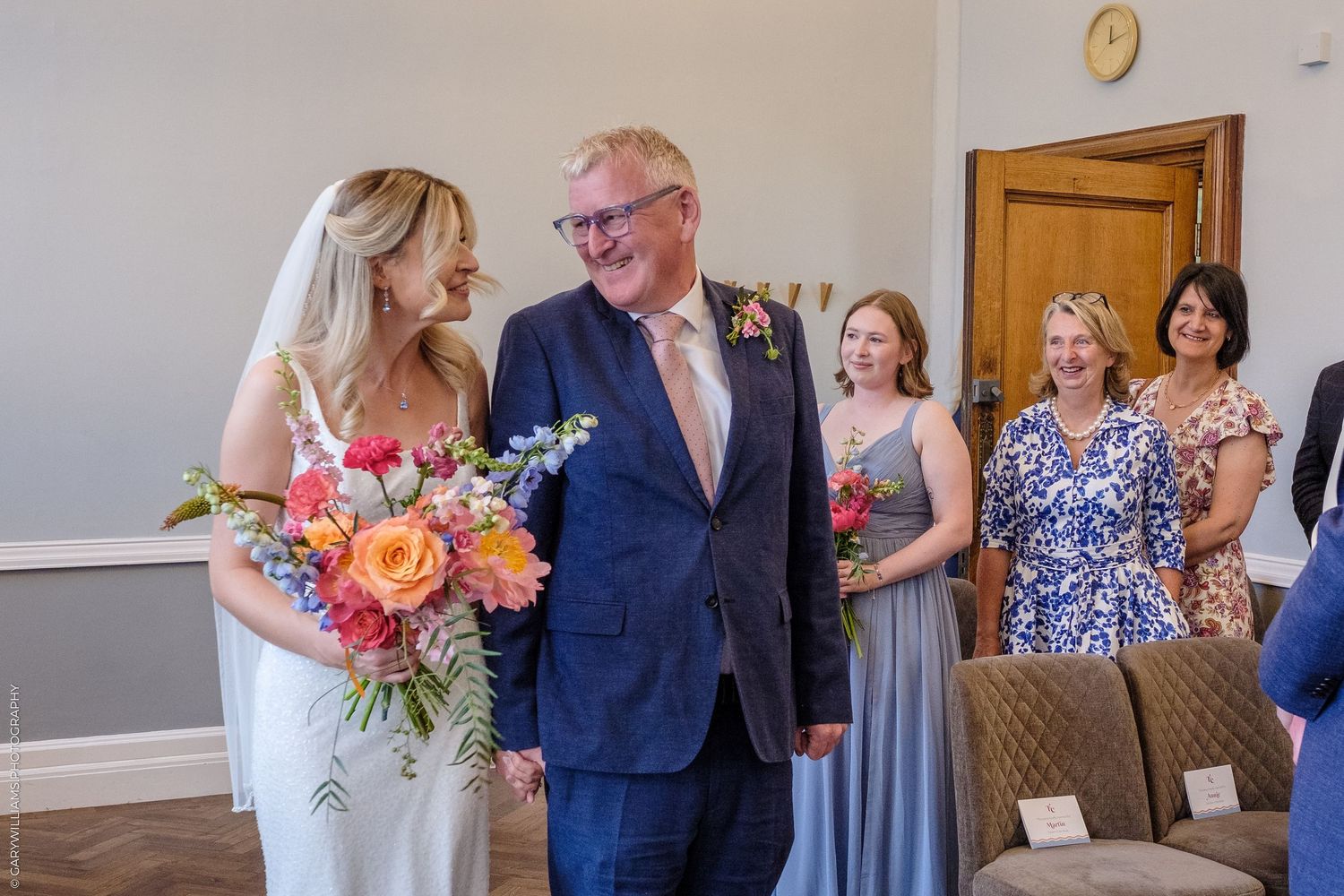 A father walks his daughter down the aisle for her wedding in Islington