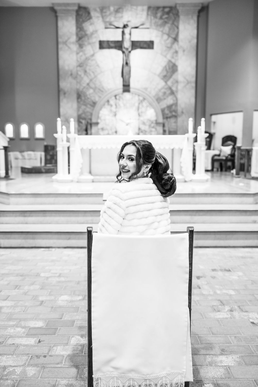 A black and white photo series showing a church interior with a crucifix and patterned floor tiles.
