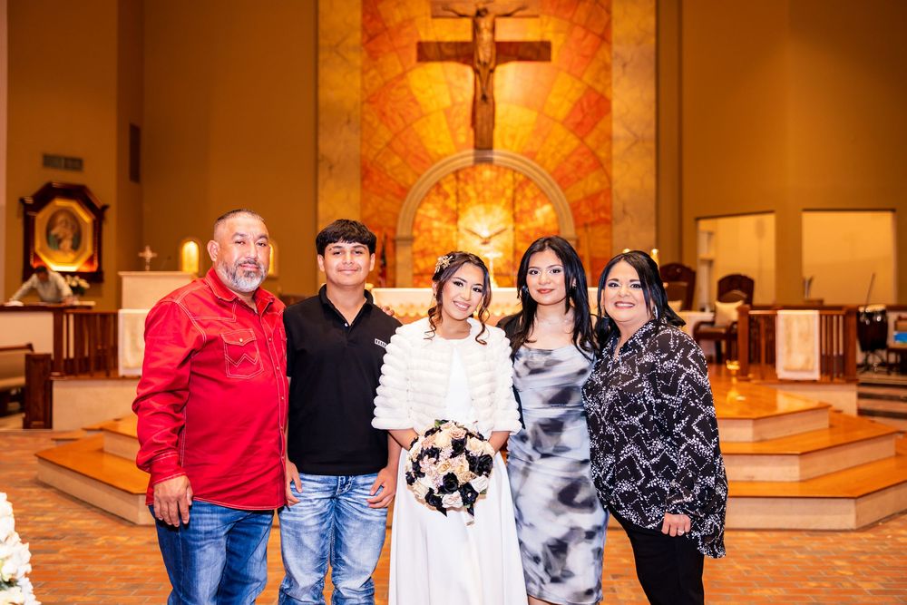People gathered inside a church with warm lighting and religious decor creating an intimate atmosphere.
