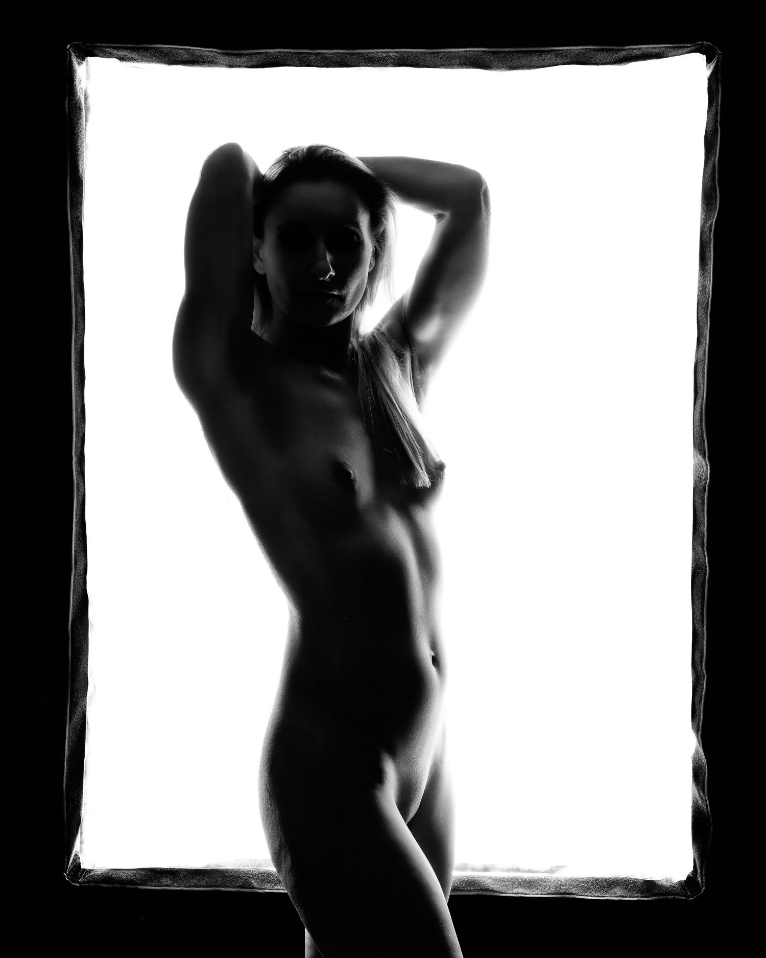 David G Holt Photography - Artistic nude silhouettes photographed against bright window light in high contrast.
