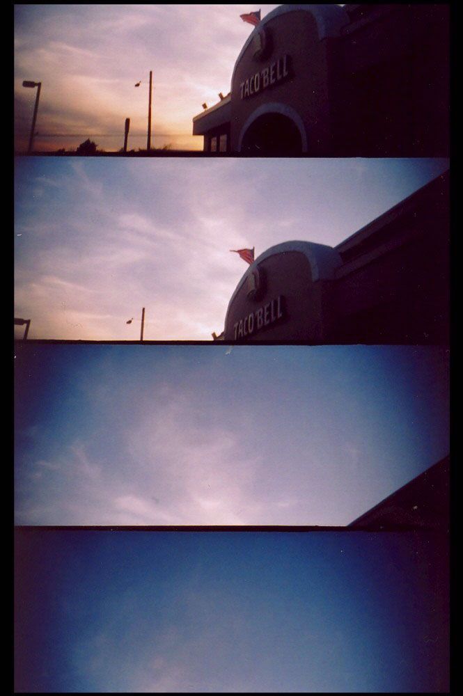 A series of four stacked photos showing a Taco Bell restaurant exterior at different times of day with changing sky colors.