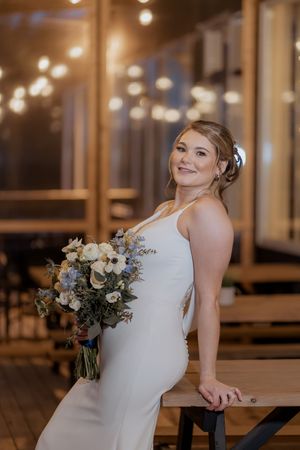 romantic wedding portraits of bride under fairy lights at Spruce and Iron, Moncton Golf Club winter wedding photography New Brunswick
