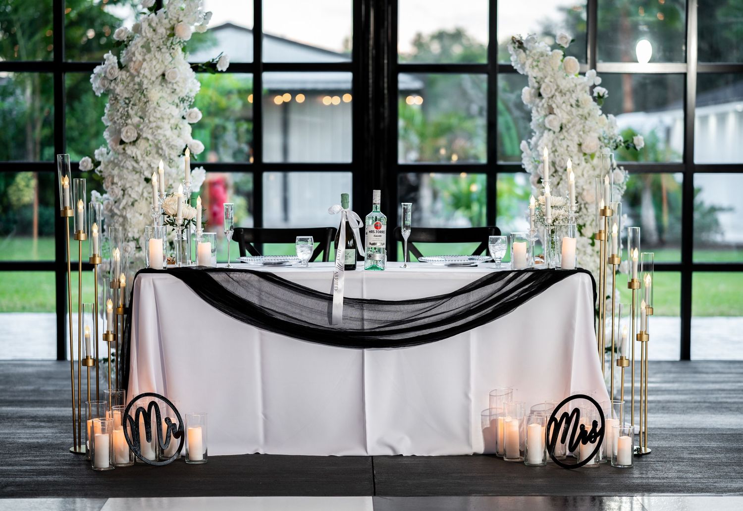 The bride and groom's table decked with florals captured luxury wedding photographers in South Florida.