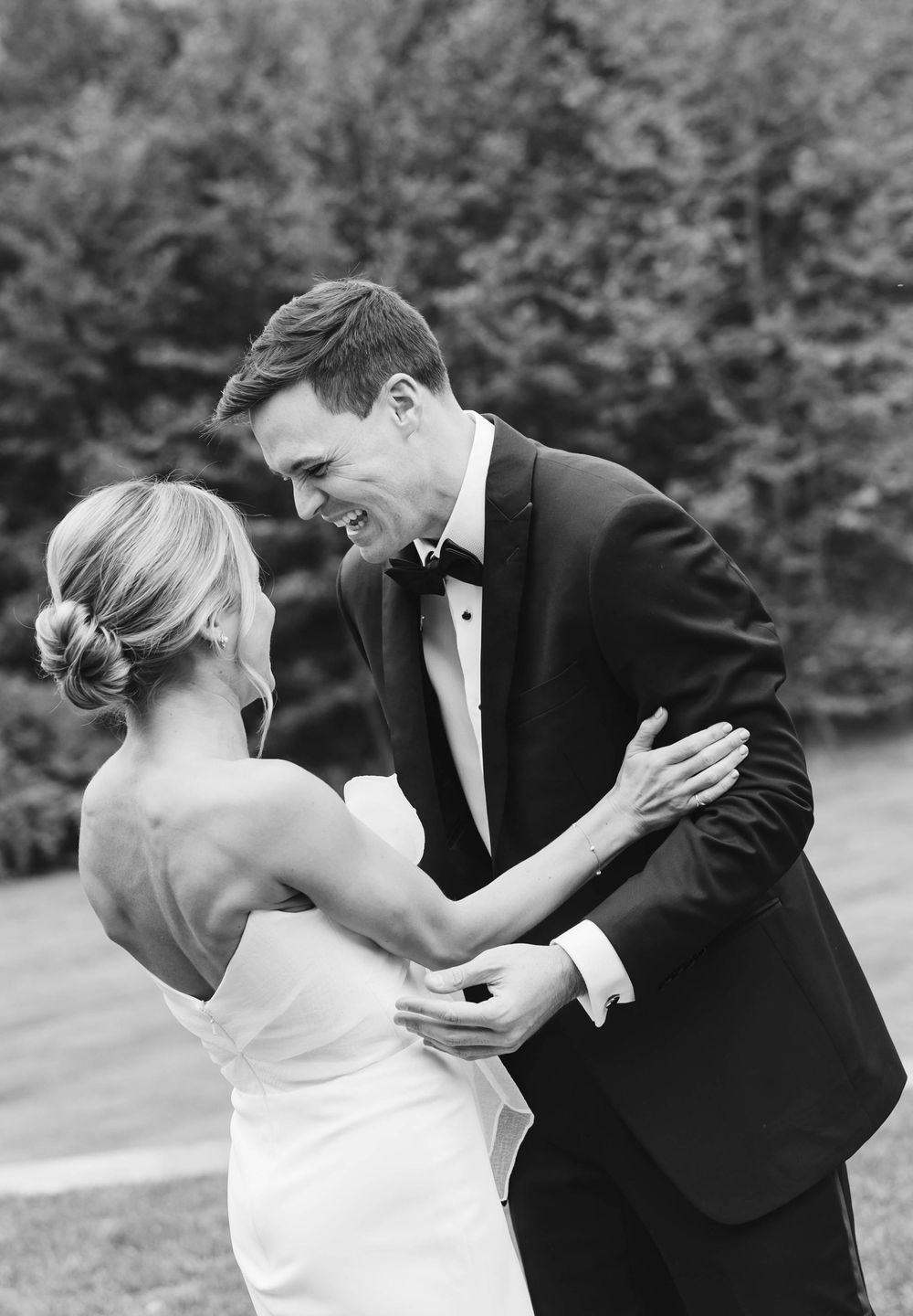 Romantic black and white portrait of couple sharing intimate moment in outdoor garden setting. Appleford Estate. Villanova, PA.