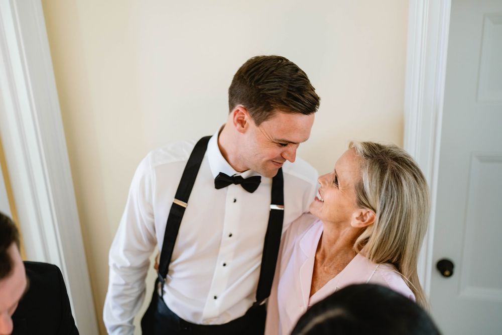 Wedding preparations in bright room with formal attire and elegant decor. Appleford Estate. Villanova, PA.