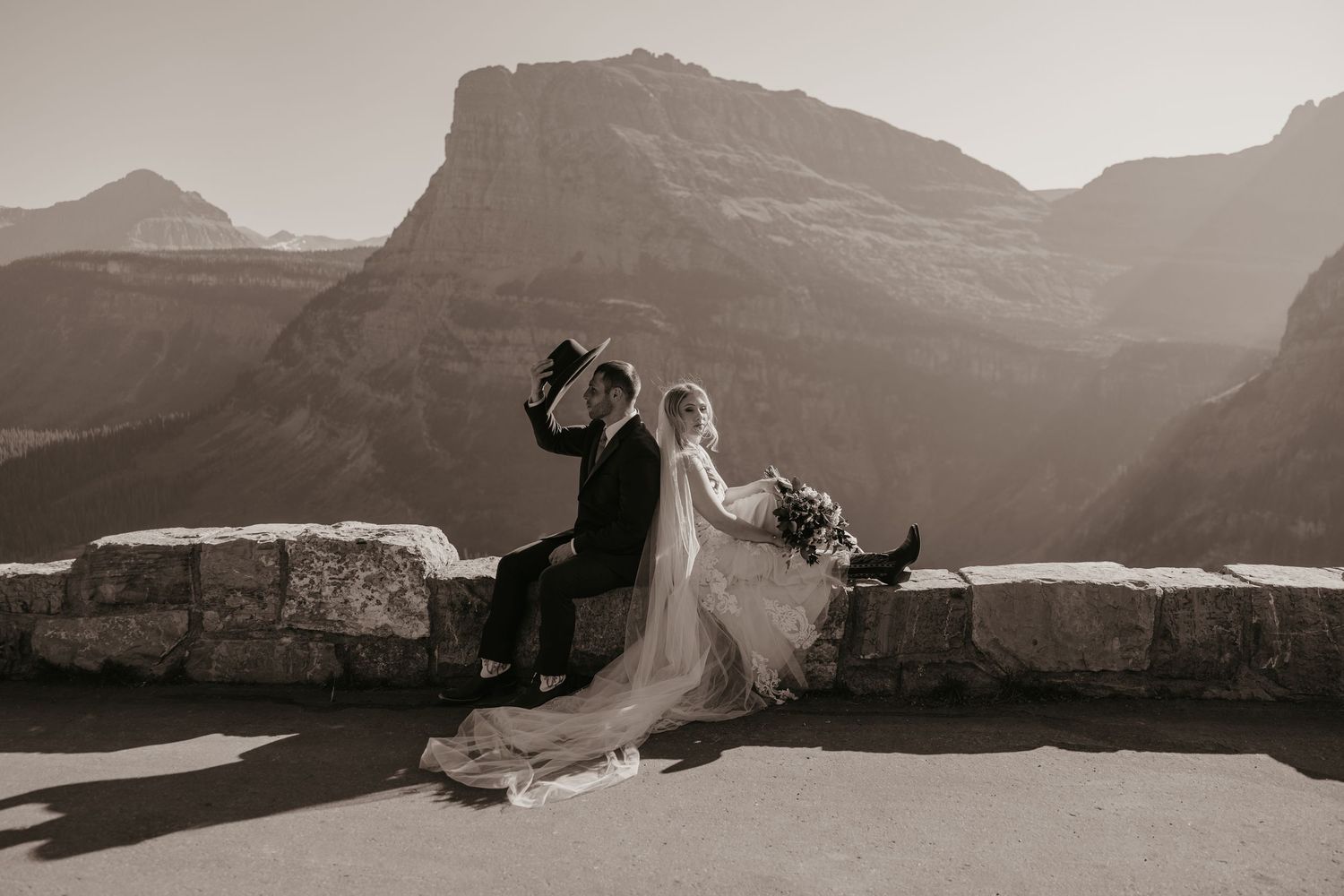 Western Cowboy Glacier National Park Elopement Captured by A Glacier Elopement Photographer in September. Along the Going to the Sun Road