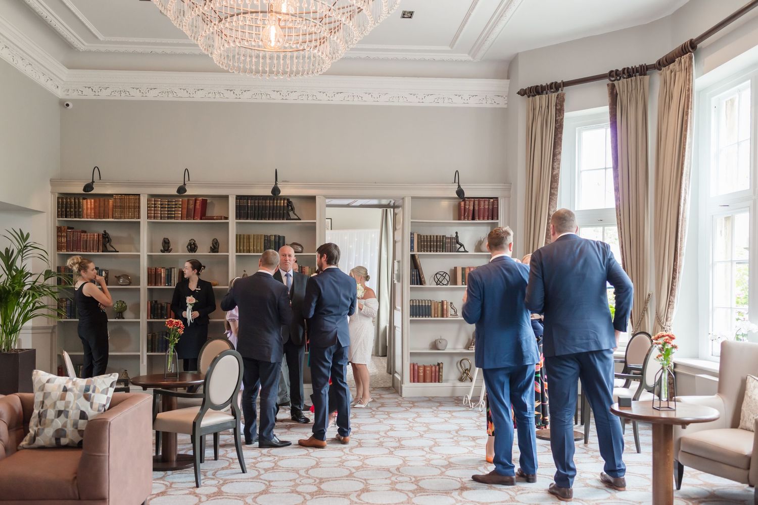 Formal wedding guests during an intimate ceremony at De Vere Cranage Estate, Holmes Chapel; luxury wedding day coverage by Michael Pardoe