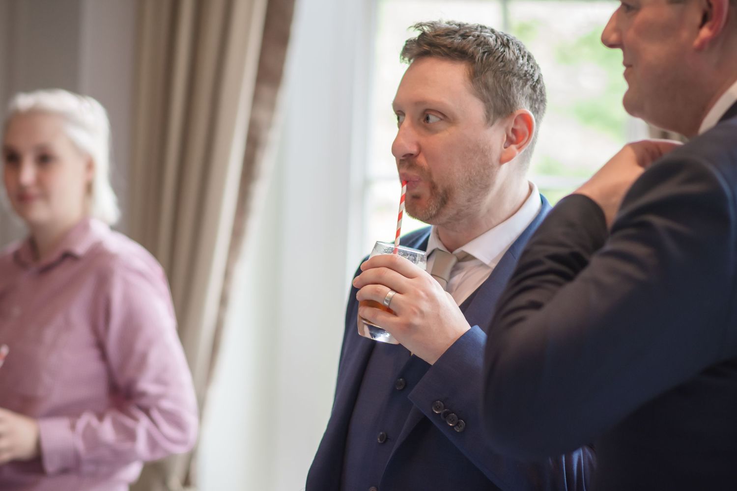 Candid wedding guest photography during a drinks reception at De Vere Cranage Estate; natural documentary wedding style by Michael Pardoe