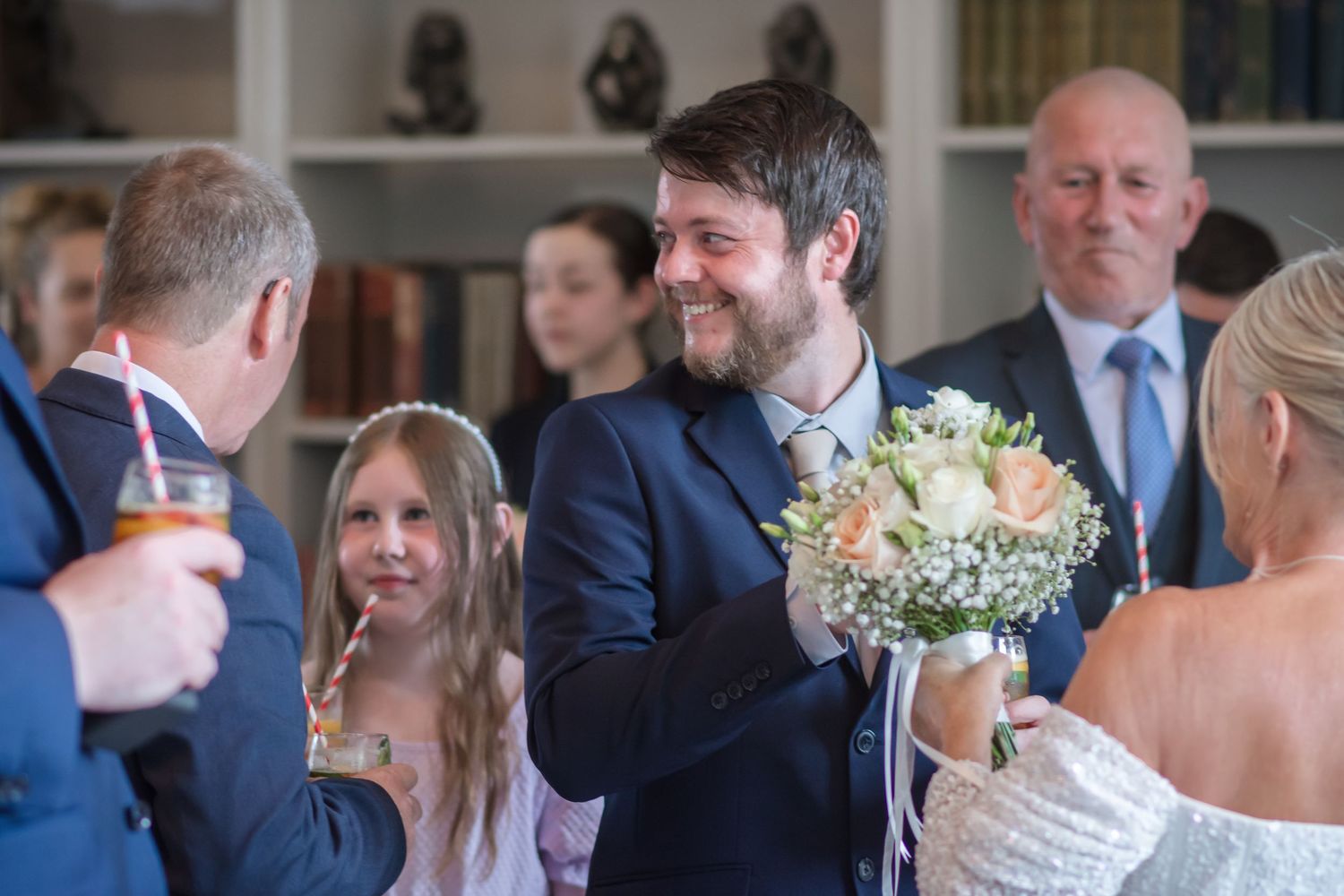 Wedding guest photography at De Vere Cranage Estate; a natural, candid shot of the drinks reception at this Holmes Chapel wedding venue