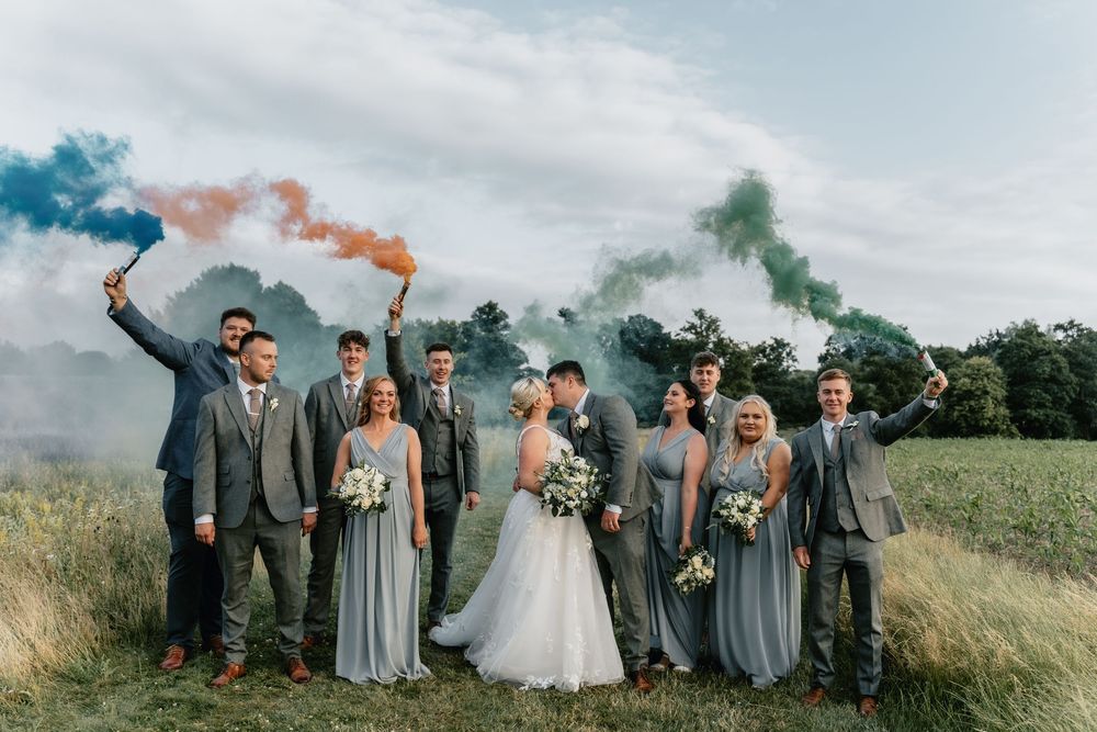 Wedding party being photographed at sunset by Worcestershire wedding photographer Laura Jenkinson