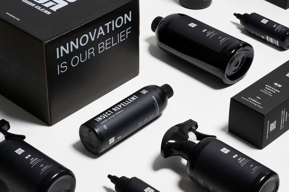 A collection of sleek black electronic devices and accessories arranged in a grid pattern against a white background.