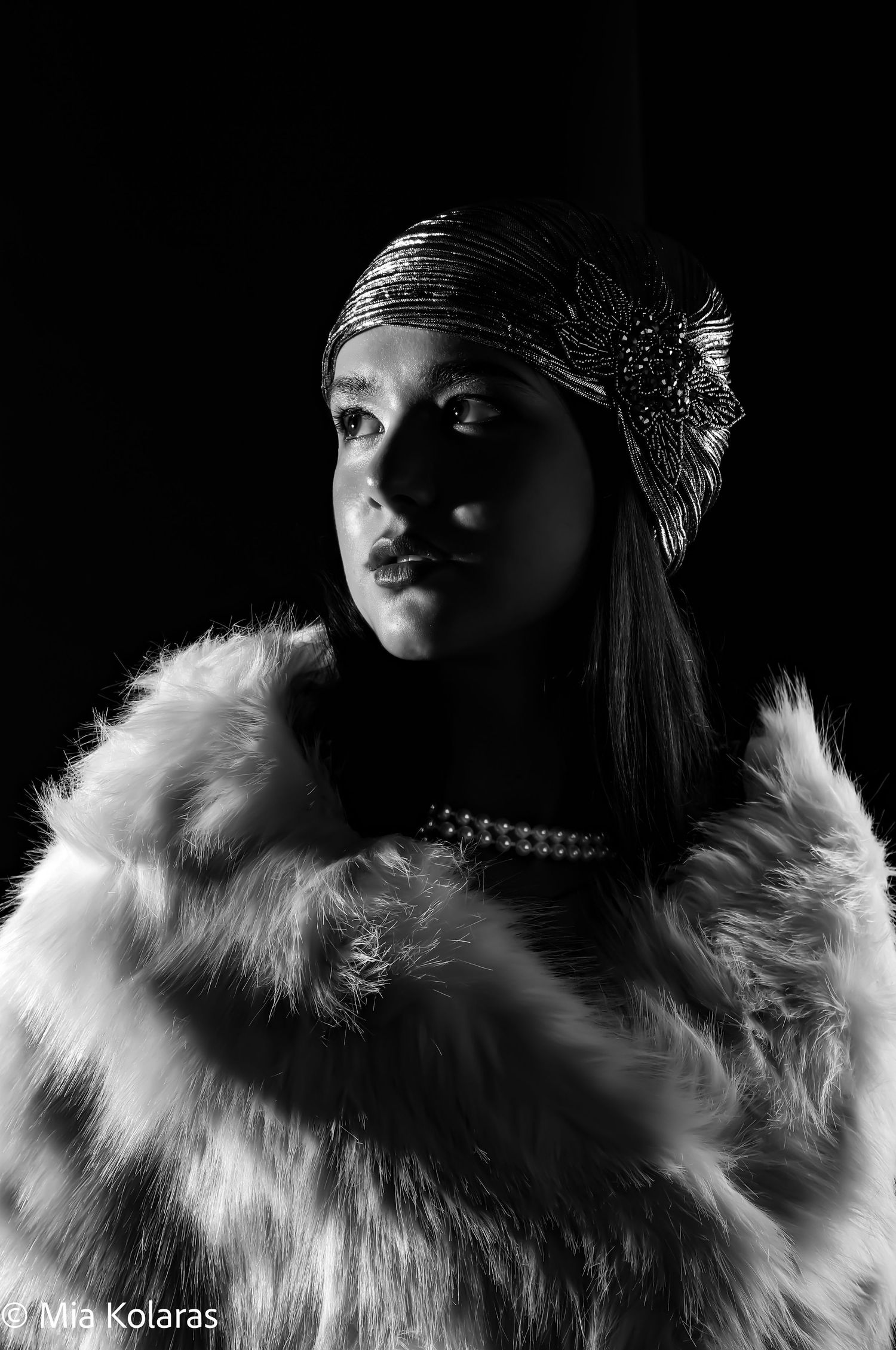 Girl in a flapper costume in a black and white photograph