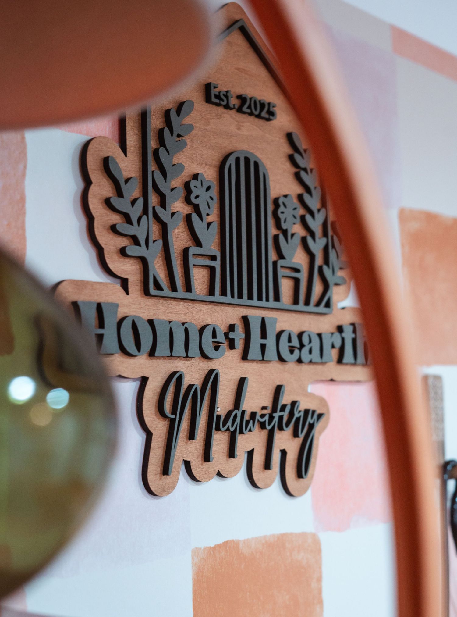 Decorative wooden wall art with intricate floral and musical design elements shown from different angles.