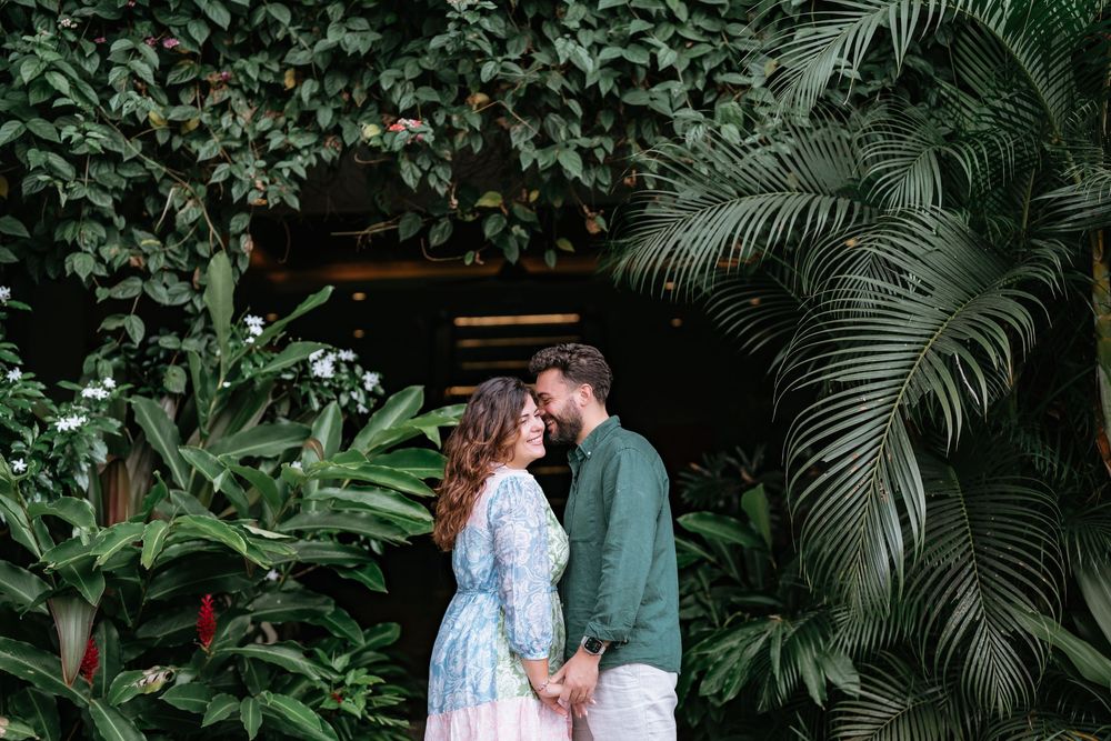 Romantic couple photoshoot at Adiwana Suweta with lush tropical surroundings.