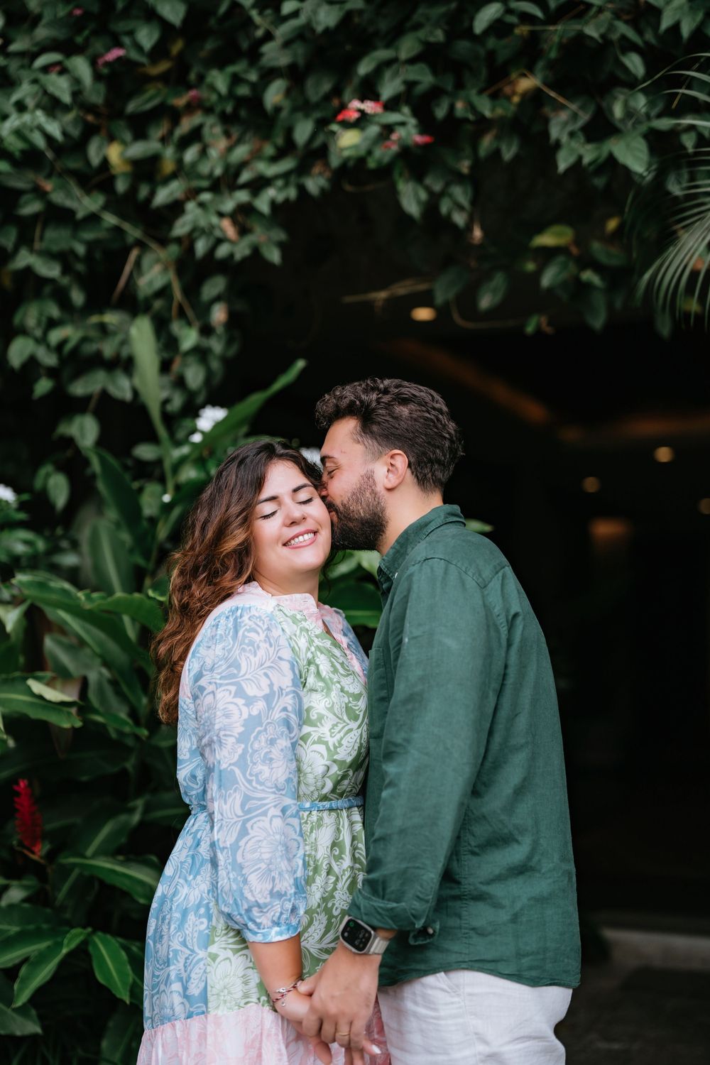 Romantic couple photoshoot at Adiwana Suweta with lush tropical surroundings.