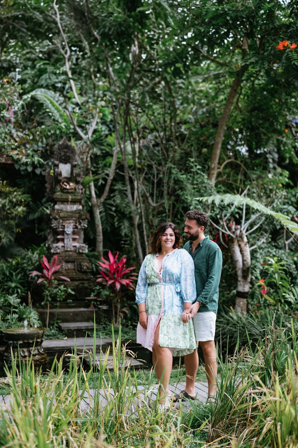 Romantic couple photoshoot at Adiwana Suweta with lush tropical surroundings.