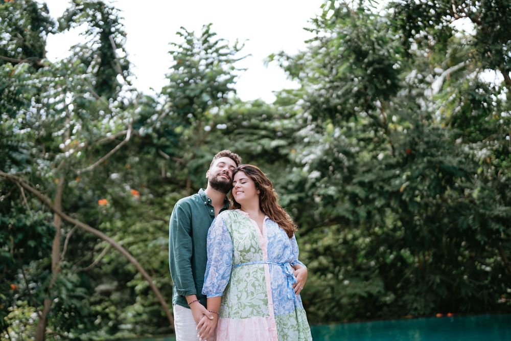 Romantic couple photoshoot at Adiwana Suweta with lush tropical surroundings.