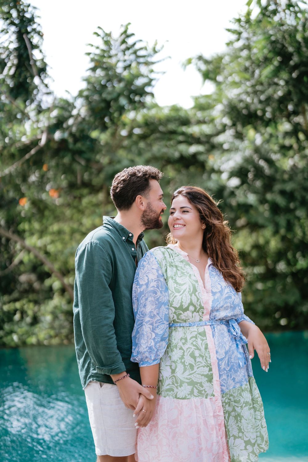 Romantic couple photoshoot at Adiwana Suweta with lush tropical surroundings.
