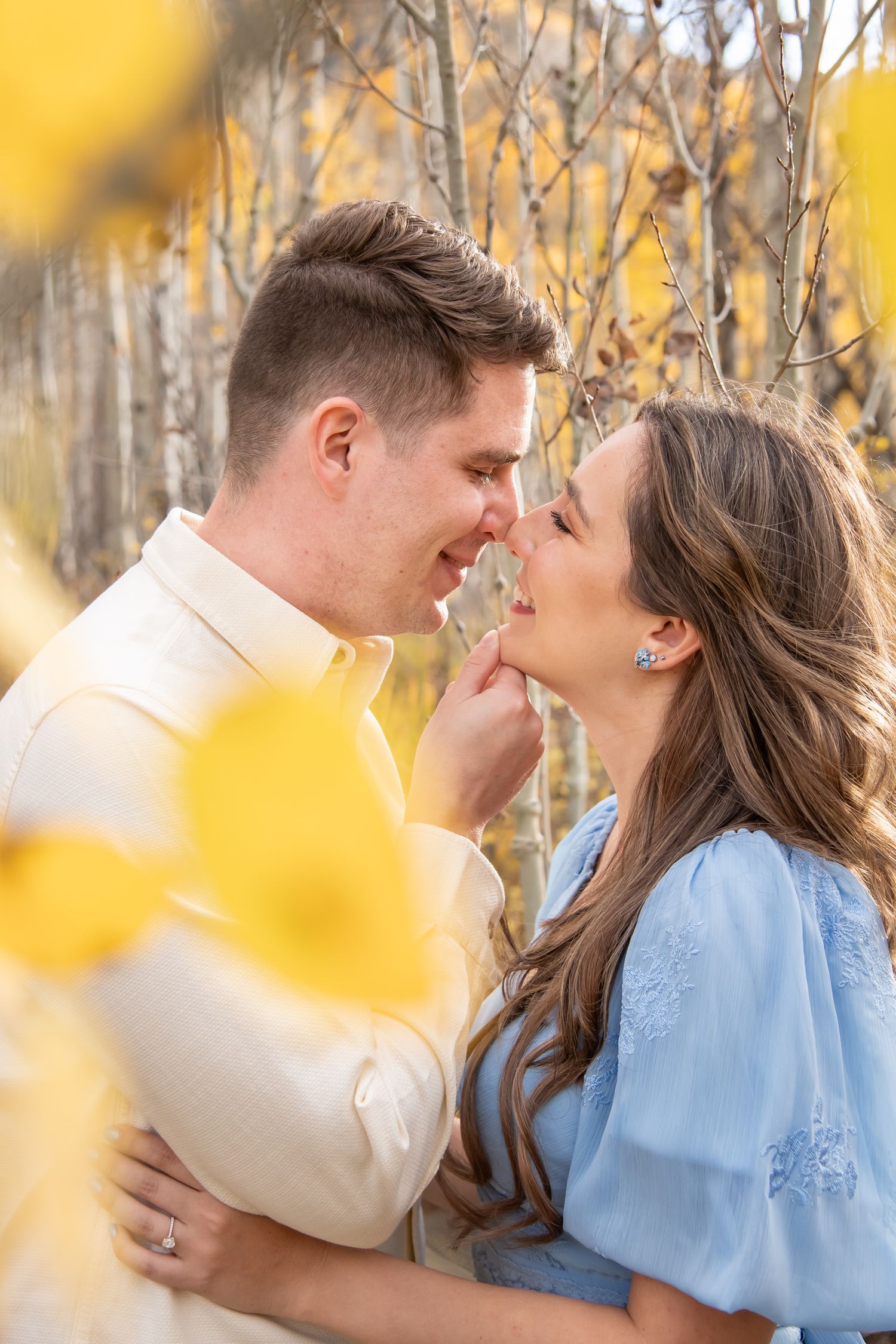 Fall photos in Vail colorado with a cute couples in the golden leaves
